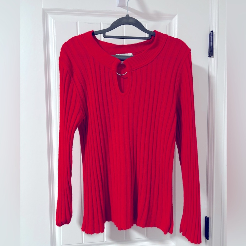 Red sweater with metallic circle detail